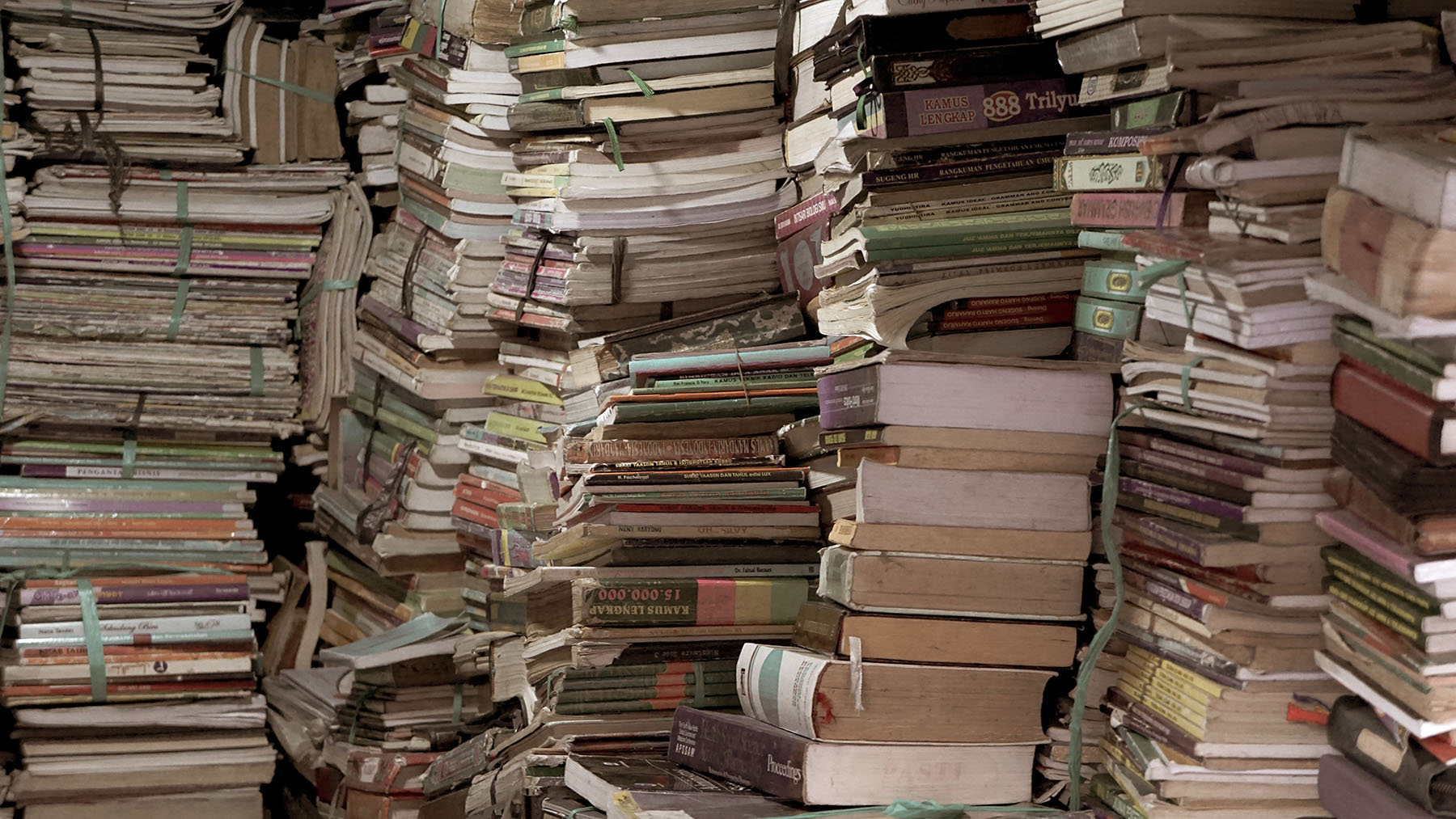 cluttered stacks of books